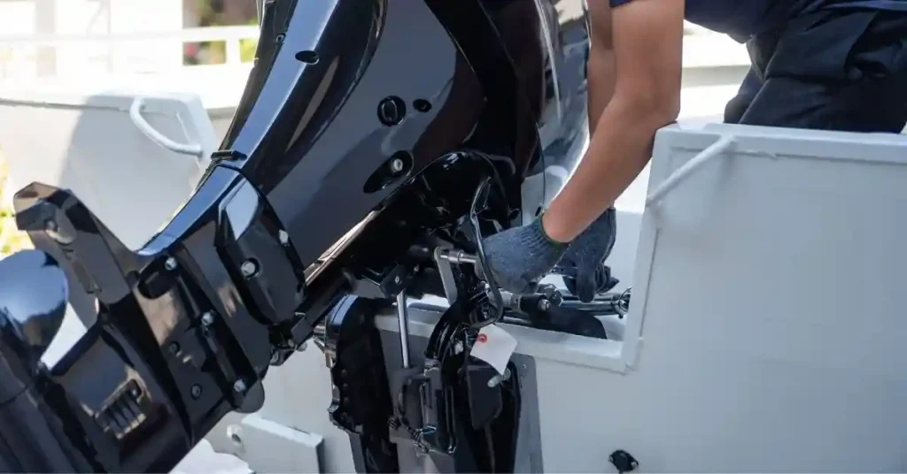 how to raise outboard motor on transom